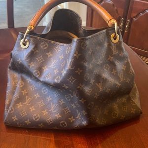 Louis Vuitton artsy. Have original receipt,box and dust bag.